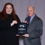 Maureen Roe and Mike Coughlin graciously accept the ACPA "Excellence in Concrete Pavements" award.