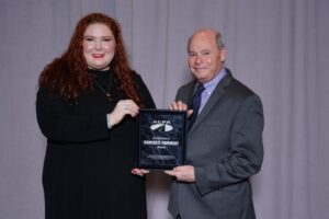 Maureen Roe and Mike Coughlin graciously accept the ACPA "Excellence in Concrete Pavements" award.